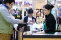 People signing name for paying credit card to buy foods at check out counter