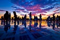 People silhouette on colorful sunset in Zadar