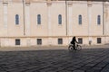 People silhouette female biker in urban walkway