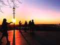 People silhouette on Sunset Old Town Of Tallinn ,Estonia panorama view from platform balcony beautiful romantic summer evenin