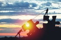 People silhouettes putting puzzle pieces together on sunlight Royalty Free Stock Photo