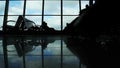 People silhouettes walking at airport