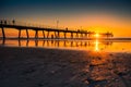 People silhouettes walking along jetty at sunset Royalty Free Stock Photo