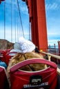 People sit on Big Bus Tour for sightseeing Golden Gate Bridge.