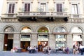 People sit in a cafe outdoor