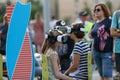 People sit on chairs in a Virtual reality headset and headphones