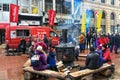 People sit by fire at Winterlude Festival in Ottawa, Canada