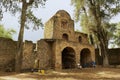 People sit in front of the entrance to Debre Berhan Selassie church territory in Gondar, Ethiopia. Royalty Free Stock Photo