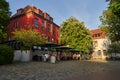 People sit in front of the restaurant Goden Wind in Vegesack, Germany