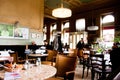 People sit inside the old stylish cafe in Vienna