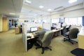 People sit in office with separated by partition places