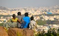 People sit into a rock