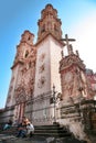 People sit on stairs of Church of Santa Prisca built between 1751 and 1758 in Taxco de Alarcon