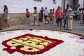 People during Sitges Corpus Christi at a flower carpet in Sitges, Spain