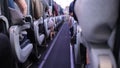 People sitting in the aisle of the plane. Royalty Free Stock Photo