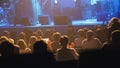 People sitting in auditorium at rock concert - Abstract blurred
