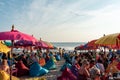 People sitting on the beach and enjoying the party life in bali august 1 2019 Royalty Free Stock Photo