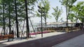 People sitting on a bench overlooking a calm body of water, enjoying the peaceful view