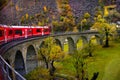 Bernina express train and admiring the scenic view on the Swiss alps Royalty Free Stock Photo