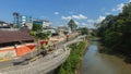 People sitting on the boardwalk of the Napo river in the center of the city in the Ecuadorian Amazon