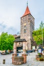 People are sitting in a cafe under Kaiserberg in Nurnberg, Germany