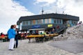 People sitting in front of Dachstein Panaromarestaurant on August 17, 2017 in Ramsau am Dachstein, Austria.