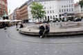 People sitting on kulturtorved on KÃÂ¸bmagergade in capital