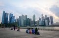 People sitting at the Marina Square in Singapore