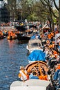 People sitting near the canal - Koninginnedag 2012