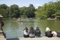 People sitting near a Pond, Central Park, NYC Royalty Free Stock Photo