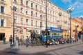 People sitting near ticket office The Horsecar Monument. St Petersburg. Russia