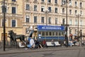 People sitting near ticket office The Horsecar Monument. St Petersburg. Russia