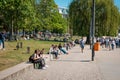 People sitting outdoor on street and in public park on a summer day in Berlin Royalty Free Stock Photo