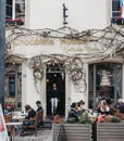 People sitting at outdoor tables of Chocolate House by Nathalie Bonn, Luxembourg City