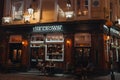 People sitting at the outdoor tables of The Crown pub on Seven Dials in Covent Garden, London, UK