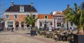 People sitting outside on the market square in Workum Royalty Free Stock Photo