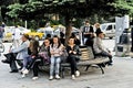 People sitting on a park bench in Bitola