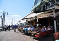 People sitting at quayside restaurant, Volendam