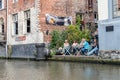 People sitting on a restaurant terrace in Embankment Graslei in