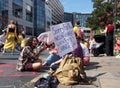 People sitting in the road at the extinction rebellion protest blocking victoria bridge in leeds