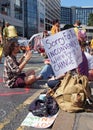 People sitting in the road at the extinction rebellion protest blocking victoria bridge in leeds