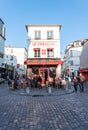 People sitting at the terrace of Le consulat restaurant in Montmartre