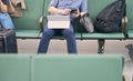 People sitting and working on tablet when waiting for delayed flight