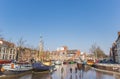 People skating on the ice in the Noorderhaven canal of Groningen