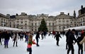 People skating on ice at the Somerset House Christmas Ice Rink. London, United Kingdom, December 2018. Royalty Free Stock Photo