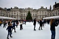 People skating on ice at the Somerset House Christmas Ice Rink. London, United Kingdom, December 2018. Royalty Free Stock Photo