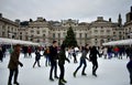 People skating on ice at the Somerset House Christmas Ice Rink. London, United Kingdom, December 2018. Royalty Free Stock Photo