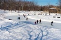 People skating at Lafontaine Park natural ice rink