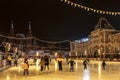 People at the skating ring on Red Square in Moscow in the evening