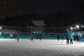 People are skating on winter skating rink